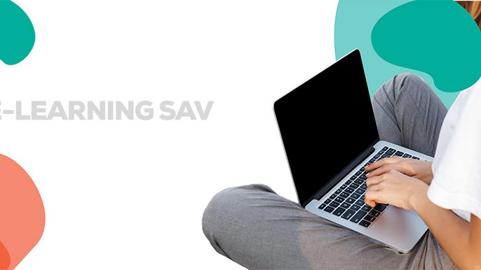 Side view of a young woman typing on laptop computer 